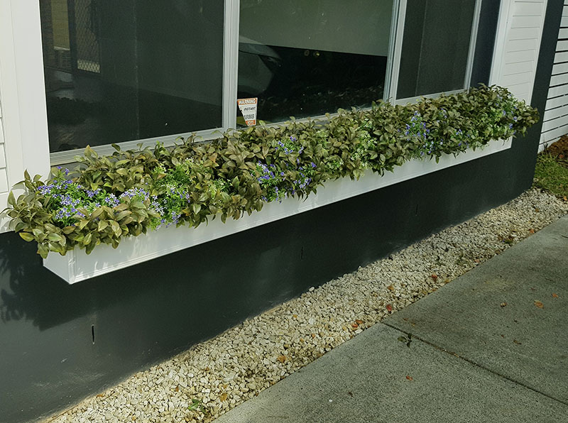 UV-treated artificial plants dress-up commercial building facade... image 8
