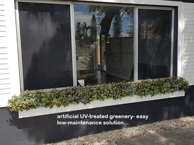 UV-treated artificial plants dress-up commercial building facade...