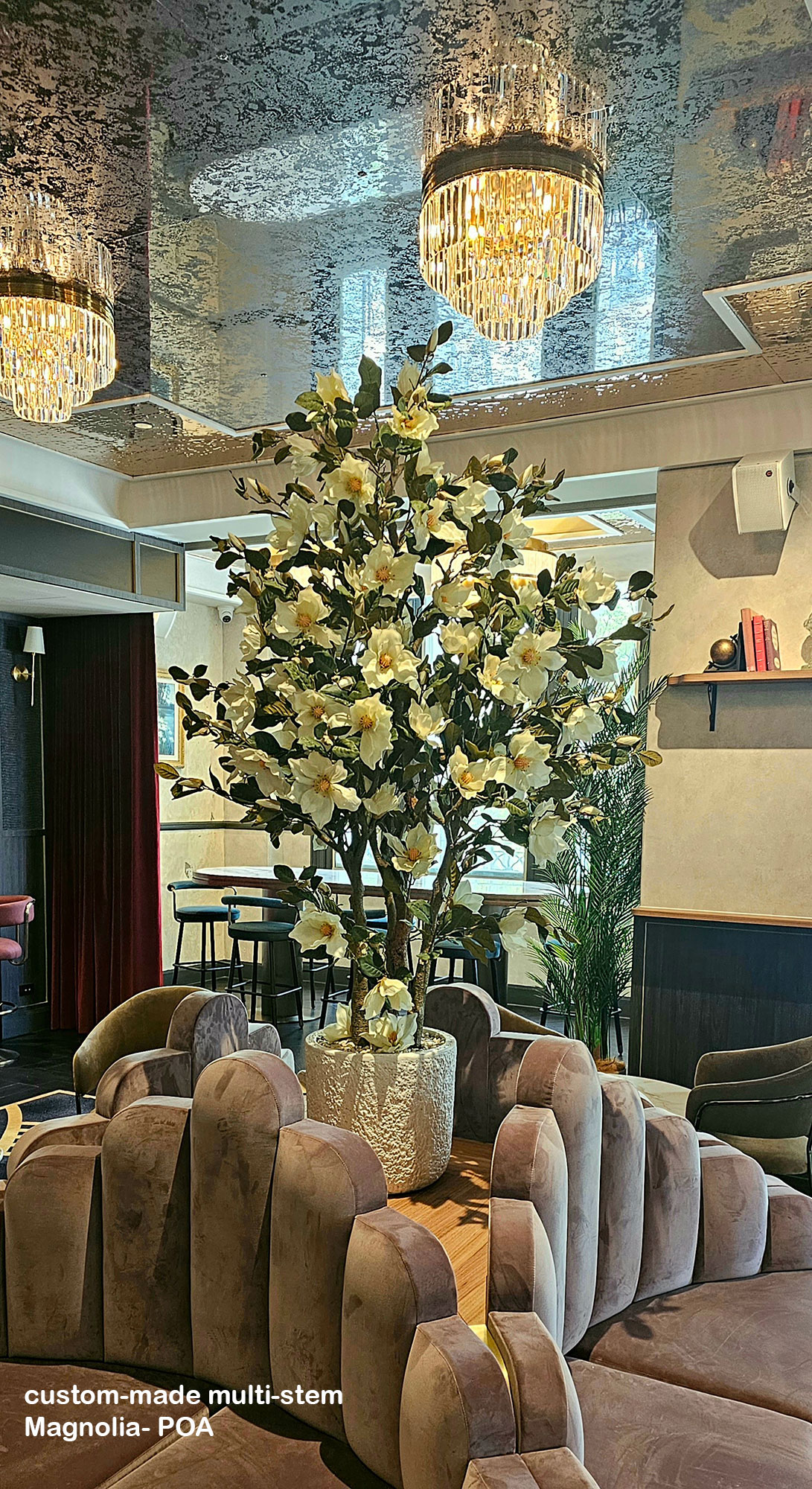 Large  feature artificial Magnolia tree in restaurant