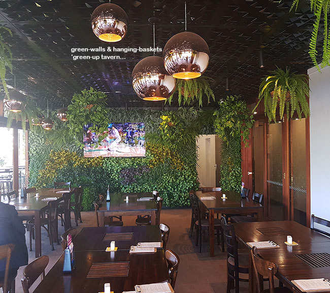 Tavern "green-over" with vertical-walls & hanging-baskets...