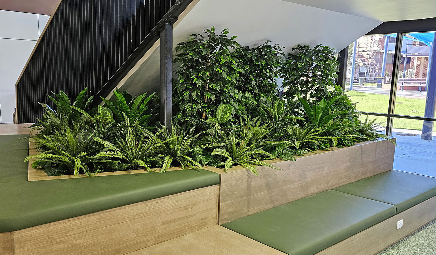 lobby staircase void filled with soft greens 