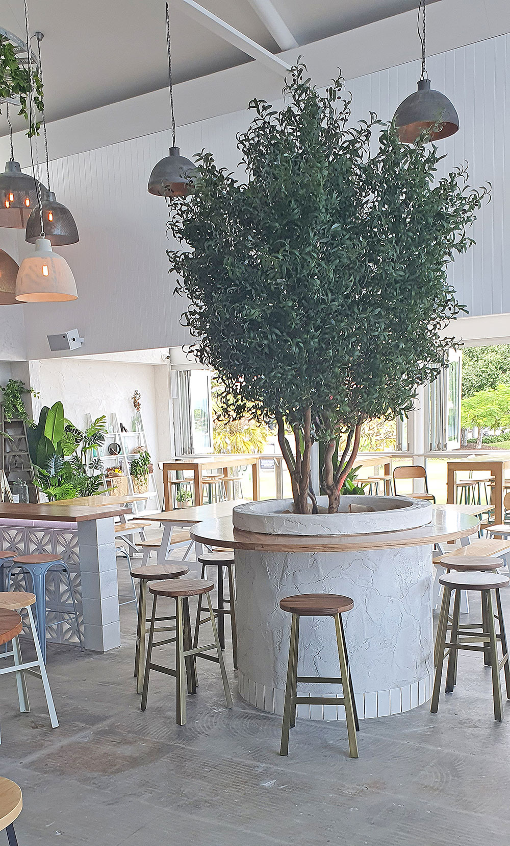 large feature artificial Olive Tree in restaurant
