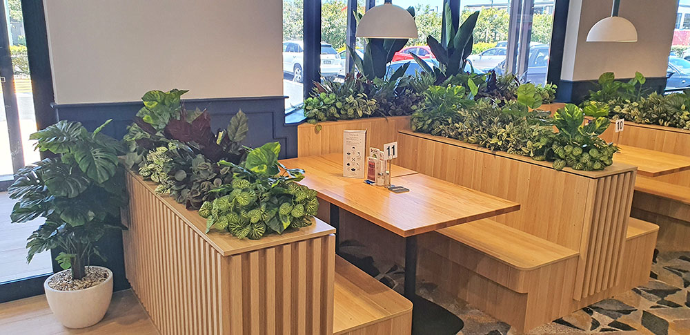 low greenery in booth planters 