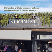 UV-treated artificial greenery softens Cafe facade & frames signage... poplet image 2