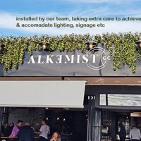 UV-treated artificial greenery softens Cafe facade & frames signage... poplet image 8