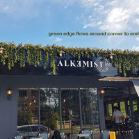 UV-treated artificial greenery softens Cafe facade & frames signage... poplet image 4