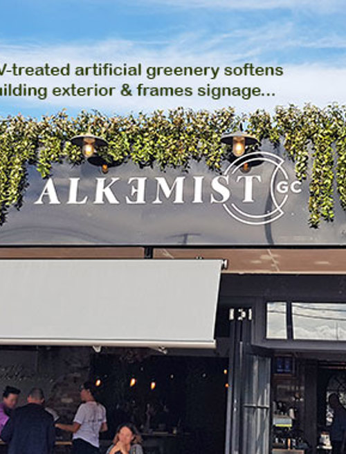 UV-treated artificial greenery softens Cafe facade & frames signage...