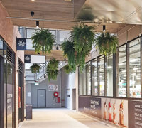 Lush green & dazzling lights- huge artificial hanging-baskets in shopping centre