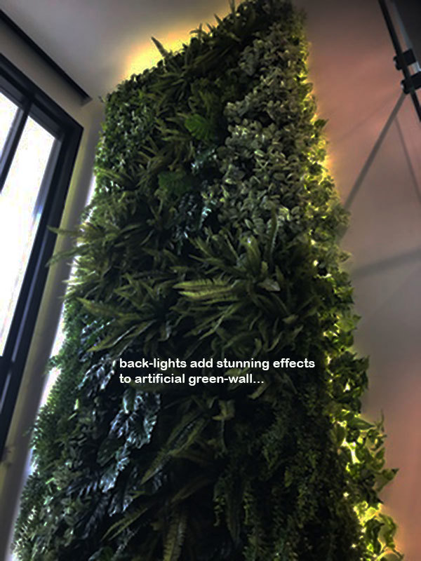 Back-lights add 'cool mood' to tall green-wall in lobby...