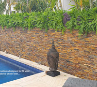 Artificial Green Wall finishes off pool side stone-wall...