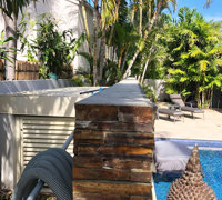 Artificial Green Wall finishes off pool side stone-wall...