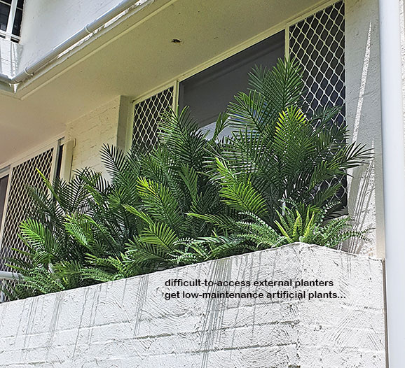 Outdoor raised planter boxes- maintenance problem solved by UV-treated artificials!