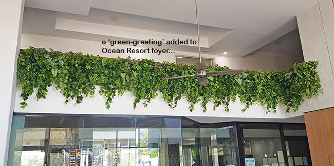 Easy-way to add greenery to a bare wall- resort foyer gets a 'green-hello'