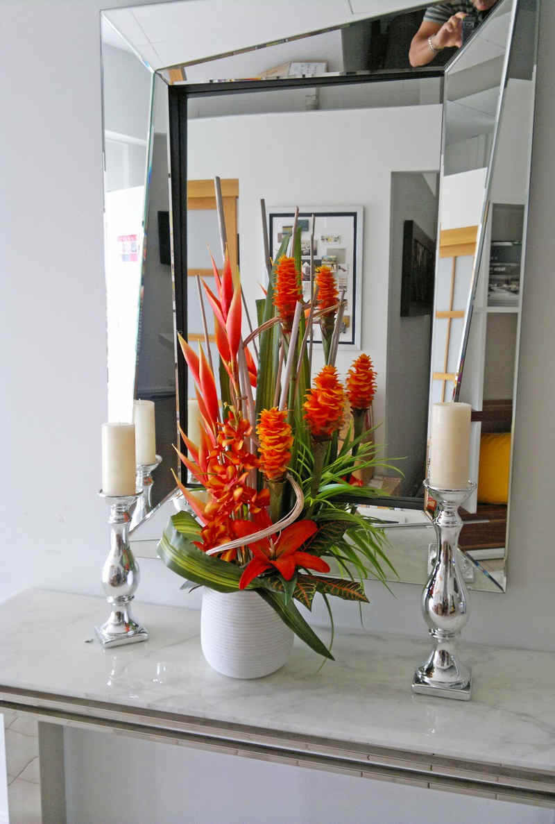 mirror reflects dynamic floral