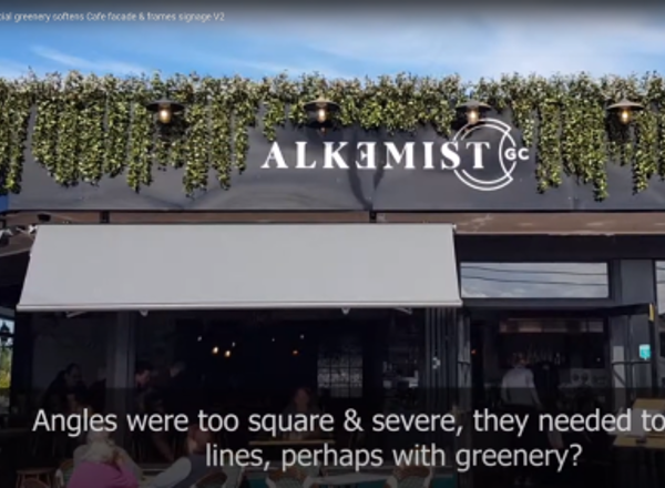 UV-treated artificial greenery softens Cafe facade & frames signage...