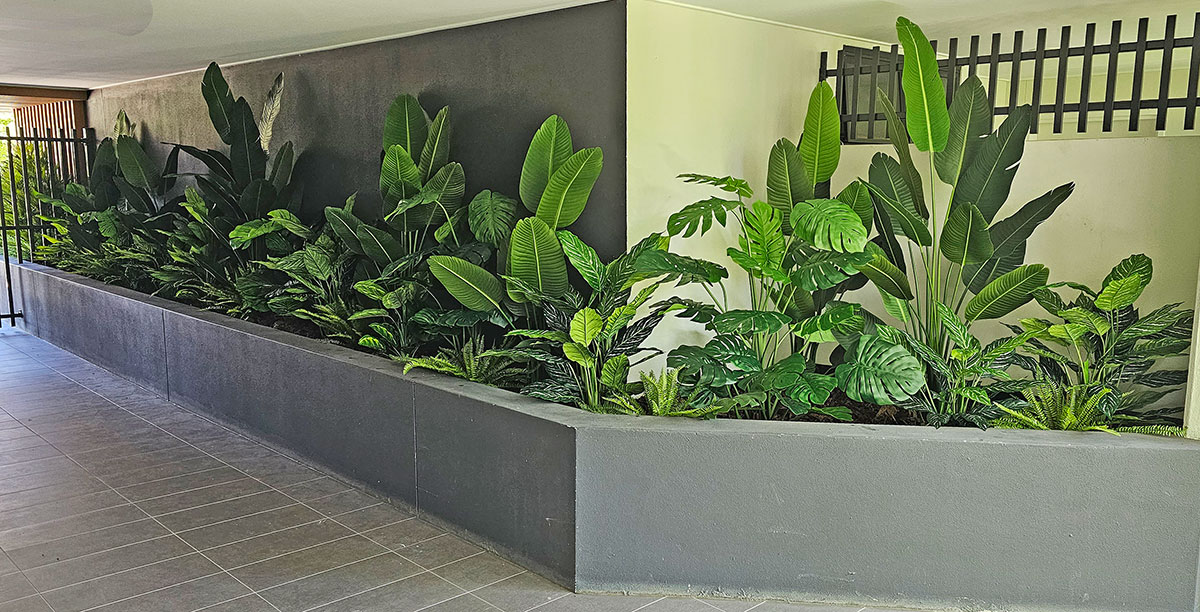 Long entry planter replaces 'dead' plants with artificials