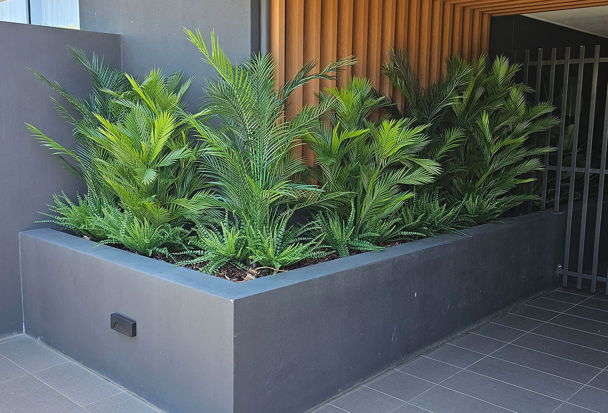 External entry planter with assorted UV-rated palms & ferns