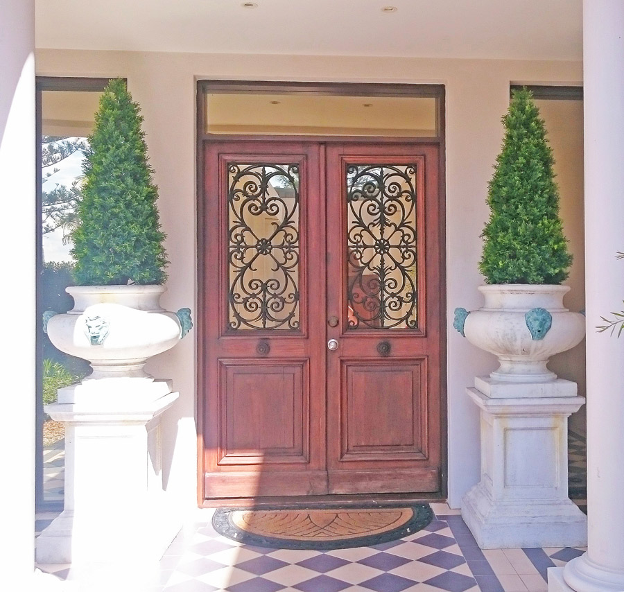 formal conifers at entrances