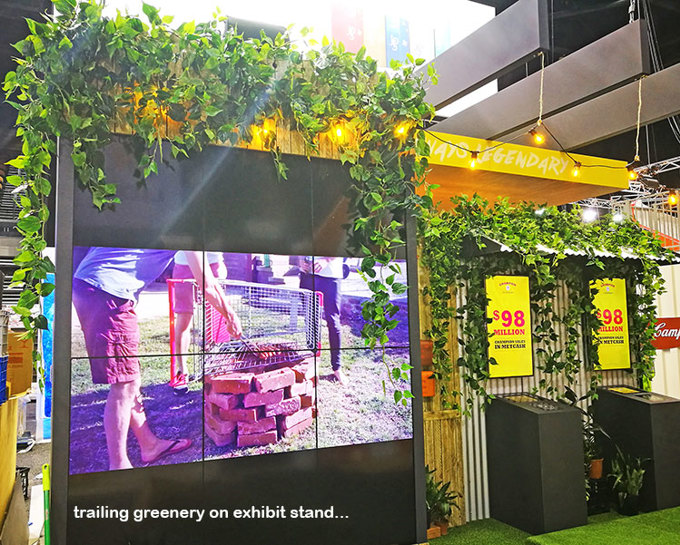 artificial Greenery to theme on exhibition display booth...