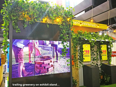 Artificial Greenery to theme on exhibition display booth...