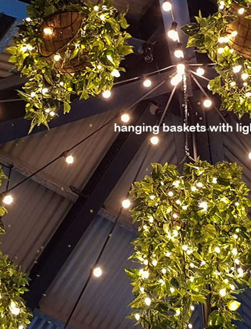 Hanging-Baskets with lights brighten up marina restaurant...