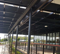 Hanging-Baskets transform new Tavern balcony from drab to cool green...