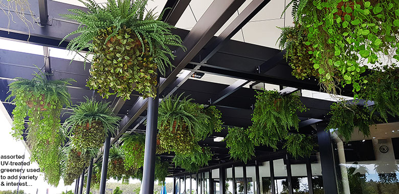 Hanging-Baskets transform new Tavern balcony from drab to cool green...