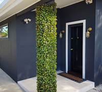 UV-treated artificial plants dress-up commercial building facade...