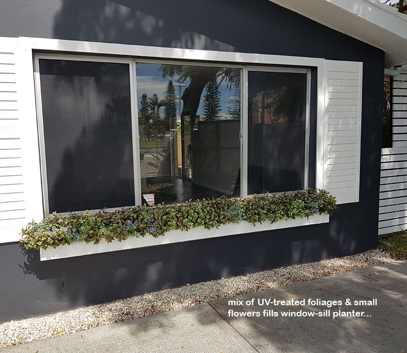 UV-treated artificial plants dress-up commercial building facade...