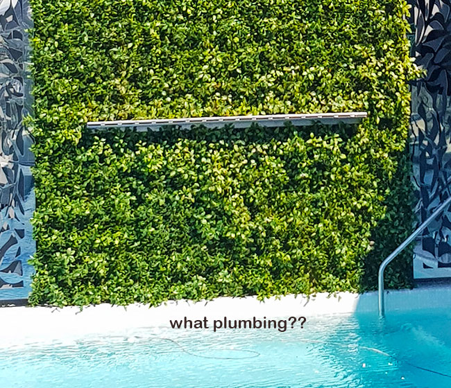 Artificial Green Wall above Penthouse Pool- tricky install!