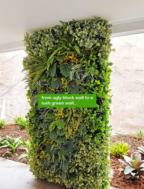 Ugly block support walls turned into lush green-screens with artificial plants