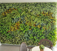 Ugly block support walls turned into lush green-screens with artificial plants