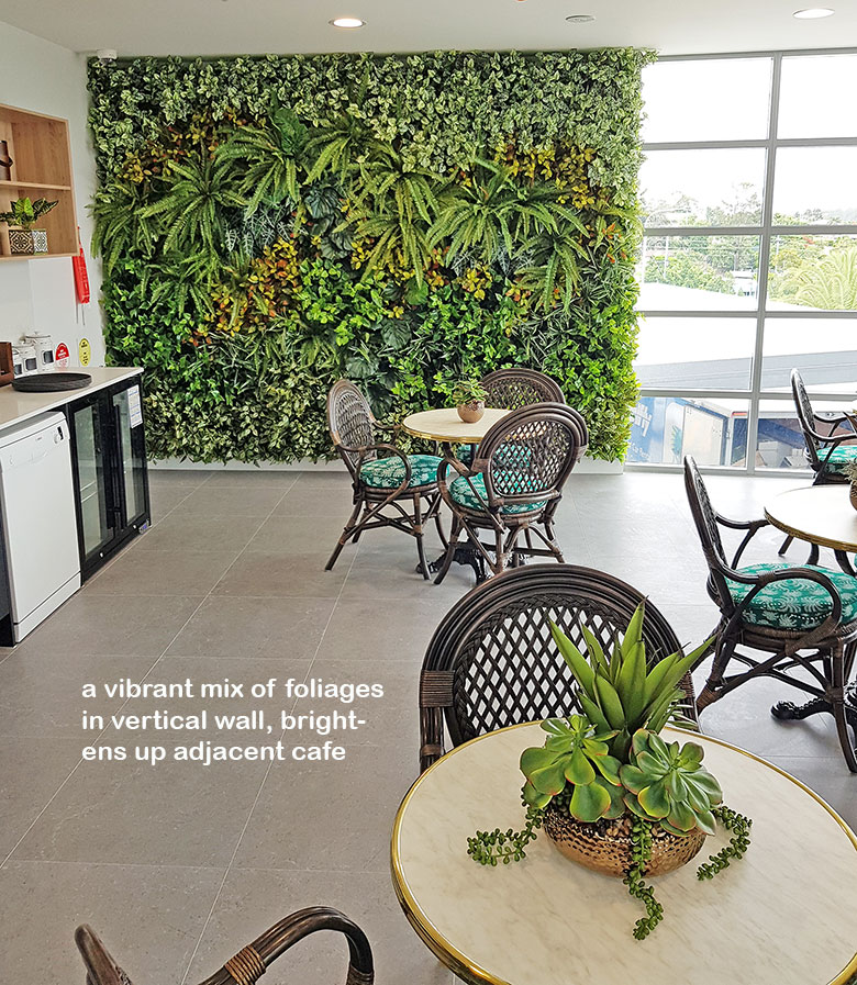 Ugly block support walls turned into lush green-screens with artificial plants