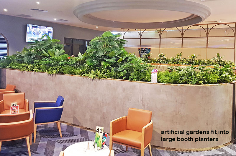 Football Clubhouse uses artificial greenery to set-off beautiful custom-built planters