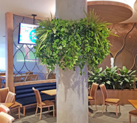 Football Clubhouse uses artificial greenery to set-off beautiful custom-built planters