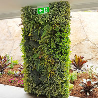 Ugly block support walls turned into lush green-screens with artificial plants poplet image 4