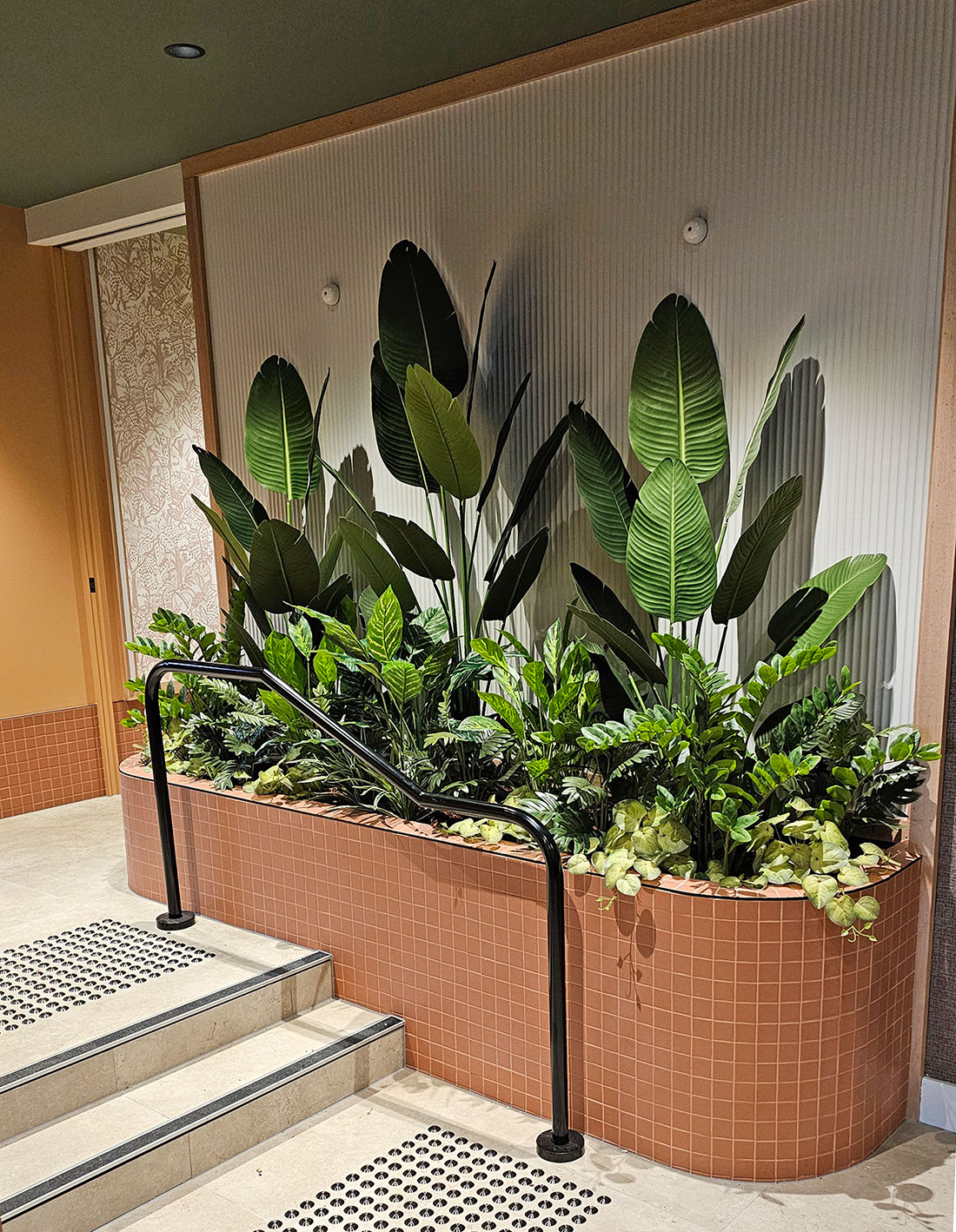 Stairway planter with lush mixed foliage... 