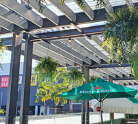Club 'greens-up' sunny Balcony Bar with latest UV-rated artificial plants...