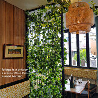 Cafe uses artificial green-vines for privacy screens & pergolas poplet image 2