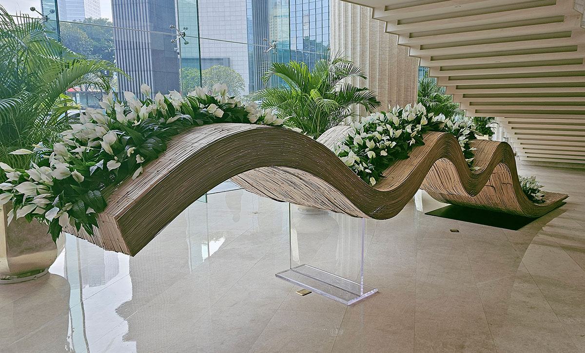 Flowering Peace Lilies flow over Foyer feature